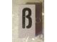 Part No: bb0695pb71  Name: Tile, Modified 1 x 2 x 5/6 Stud Hole in End with Black Lowercase Letter Sharp s (ß) Pattern