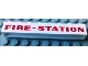 Part No: crssprt01pb47  Name: Brick 1 x 8 without Bottom Tubes with Cross Side Supports with Red 'FIRE-STATION' Bold Pattern