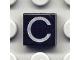 Lot ID: 404022704  Part No: 3070pb011  Name: Tile 1 x 1 with Silver Capital Letter C Pattern