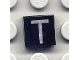 Lot ID: 250757986  Part No: 3070pb028  Name: Tile 1 x 1 with Silver Capital Letter T Pattern