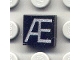 Lot ID: 10854959  Part No: 3070pb037  Name: Tile 1 x 1 with Silver Capital Letter Æ Pattern