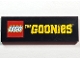 Part No: 69729pb212 Name: Tile 2 x 6 with LEGO Logo and Yellow 'THe GOONieS' Pattern Part No: 69729pb212 Name: Tile 2 x 6 with LEGO Logo and Yellow 'THe GOONieS' Pattern