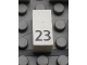 Part No: Mx1021Apb42  Name: Modulex, Tile 1 x 2 with Black Calendar Day Number '23' Pattern