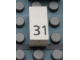 Lot ID: 123468667  Part No: Mx1021Apb50  Name: Modulex, Tile 1 x 2 with Black Calendar Day Number '31' Pattern