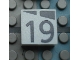 Part No: Mx1022Apb175  Name: Modulex, Tile 2 x 2 (no Internal Supports) with Dark Gray Slopes and Calendar Week Number 19 Pattern