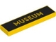 Lego part: Tile 1 x 4 with 'MUSEUM' on Black Background Pattern