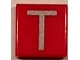 Part No: 3070pb028  Name: Tile 1 x 1 with Silver Capital Letter T Pattern