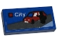 Part No: 3069pb1136  Name: Tile 1 x 2 with LEGO City Set Box Art, Black Minifigure Silhouette and Red Car with White Side Windows Pattern (Sticker) - Set 40574