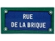 Part No: 87079pb1420  Name: Tile 2 x 4 with Dark Blue Sign, 4 White Rivets and 'RUE DE LA BRIQUE' Pattern (Sticker) - Set 910032