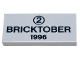 Part No: 87079pb0011  Name: Tile 2 x 4 with Black Number 2 in Circle and 'BRICKTOBER 1996' Pattern