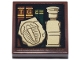 Part No: 11203pb121  Name: Tile, Modified 2 x 2 Inverted with Reddish Brown and Dark Green Books, Gold Trim and Letters T and G, Tan Legoland Minifigure and Trilobite Fossil Pattern (Sticker) - Set 21355
