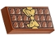 Part No: 3069pb0440  Name: Tile 1 x 2 with Candy Bar Chocolate Blocks and Gold Bow Pattern