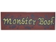 Part No: 69729pb174  Name: Tile 2 x 6 with Dark Brown Spots and Splatters and Gold Script 'Monster Book' Pattern