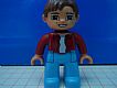 invID: 46747576 M-No: 47394pb019  Name: Duplo Figure Lego Ville, Male, Medium Blue Legs, Dark Red Top, Reddish Brown Hair, Blue Eyes