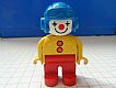 invID: 200612569 M-No: 4555pb001  Name: Duplo Figure, Male Clown, Red Legs, Yellow Top with 2 Buttons, Yellow Arms, Blue Aviator Helmet