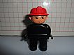 invID: 336890550 M-No: 4555pb162a  Name: Duplo Figure, Male Fireman, Black Legs, Black Top (no buttons), Red Fire Helmet, no White in Eyes Pattern